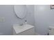 Bathroom with a white vanity, modern fixtures, and neutral paint at 70 S Patterson St, Coats, NC 27521