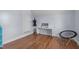 Small bedroom featuring hardwood floors, neutral walls, and a desk at 70 S Patterson St, Coats, NC 27521