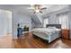 Bedroom featuring hardwood floors, a fireplace, and neutral walls at 70 S Patterson St, Coats, NC 27521