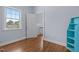Bedroom with hardwood floors, large window for natural light, and a closet at 70 S Patterson St, Coats, NC 27521