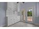 Bright breakfast nook featuring French doors and built in cabinets for extra storage at 70 S Patterson St, Coats, NC 27521