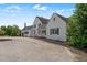 A sprawling white brick home with a circular driveway and meticulously landscaped grounds at 70 S Patterson St, Coats, NC 27521