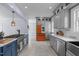 Modern kitchen boasts stainless steel appliances, including chef style oven, island and white countertops at 70 S Patterson St, Coats, NC 27521