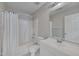 Bathroom featuring a shower with white curtain, toilet, sink, and vanity with mirror, creating a functional and clean space at 7024 Beaverwood Dr, Raleigh, NC 27616