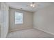 Cozy bedroom featuring carpet flooring, a window for natural light, and closet, creating a comfortable personal space at 7024 Beaverwood Dr, Raleigh, NC 27616