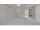 Expansive bedroom with neutral walls, carpet flooring, ceiling fan, ensuite bathroom, and closet at 7024 Beaverwood Dr, Raleigh, NC 27616