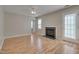 Comfortable living room featuring a fireplace and access to the patio at 7024 Beaverwood Dr, Raleigh, NC 27616