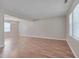 Spacious living room with wood flooring and ample natural light at 7024 Beaverwood Dr, Raleigh, NC 27616