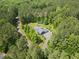 The property is surrounded by lush greenery, offering a serene and private setting from above at 741 Sinai Cir, Hillsborough, NC 27278