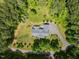 Stunning aerial view of the property, highlighting the beautiful landscaping and wooded surroundings at 741 Sinai Cir, Hillsborough, NC 27278