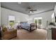 Cozy bedroom with a ceiling fan, carpet floors, and natural lighting at 741 Sinai Cir, Hillsborough, NC 27278
