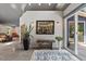 Inviting entryway featuring plants, sconces and a decorative blue and white rug at 741 Sinai Cir, Hillsborough, NC 27278