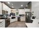 Modern kitchen with stainless steel appliances, white cabinetry, and eat-in seating at 741 Sinai Cir, Hillsborough, NC 27278