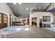 Expansive open living area with high ceilings, recessed lighting, and polished concrete floors, designed for modern living at 741 Sinai Cir, Hillsborough, NC 27278