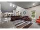 Spacious living room with a modern design with large leather sectional sofa and rug at 741 Sinai Cir, Hillsborough, NC 27278