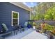 Private patio area with stylish outdoor furniture, creating a relaxing retreat at 741 Sinai Cir, Hillsborough, NC 27278