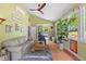 Inviting sunroom with natural light and a cozy seating area for relaxing and entertaining at 741 Sinai Cir, Hillsborough, NC 27278