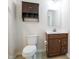 Full bathroom with a wood vanity, brushed nickel hardware and fixtures at 75 Springwood Ln, Franklinton, NC 27525