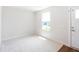 Bright bedroom with natural light, neutral carpet, and door with modern hardware at 75 Springwood Ln, Franklinton, NC 27525