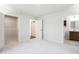 Spacious bedroom with neutral carpet, walk in closet and an ensuite bathroom at 75 Springwood Ln, Franklinton, NC 27525