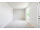 Neutral bedroom featuring a light fixture and a window with natural light at 75 Springwood Ln, Franklinton, NC 27525