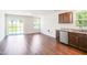 Bright kitchen area with sliding glass doors and stainless steel dishwasher and sink at 75 Springwood Ln, Franklinton, NC 27525