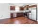 New kitchen features stainless steel appliances, granite countertops, and wooden cabinetry at 75 Springwood Ln, Franklinton, NC 27525