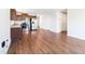 Open-concept kitchen and living area with modern appliances and wood-look flooring at 75 Springwood Ln, Franklinton, NC 27525