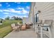 A charming back patio setup with lots of seating at 81 Paperwhite Pl # 213, Clayton, NC 27527