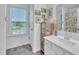 Well-lit bathroom featuring a single sink vanity and a window with a scenic view at 81 Paperwhite Pl # 213, Clayton, NC 27527