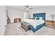 Bright primary bedroom with blue accents and ample natural light at 81 Paperwhite Pl # 213, Clayton, NC 27527
