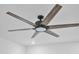 Close-up of a modern six-blade ceiling fan with a light fixture in a room with white walls and a recessed light at 81 Paperwhite Pl # 213, Clayton, NC 27527