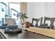 Dining table set with plates, cutlery, a table runner, and a floral centerpiece, with a window in the background at 81 Paperwhite Pl # 213, Clayton, NC 27527