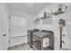 Well-lit laundry room with modern washer and dryer at 81 Paperwhite Pl # 213, Clayton, NC 27527