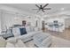 Open-concept living room showcasing modern décor, hardwood floors, and a seamless transition to the adjacent kitchen at 81 Paperwhite Pl # 213, Clayton, NC 27527