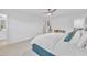 Bright main bedroom boasts a ceiling fan, with a bed and walk-in to the main bathroom at 81 Paperwhite Pl # 213, Clayton, NC 27527