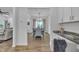 Open concept living and dining area with a view from the kitchen, showcasing modern decor and layout at 81 Paperwhite Pl # 213, Clayton, NC 27527