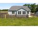 Exterior showcasing the back of the house and the fenced backyard at 834 Mamie Upchurch Rd, Lillington, NC 27546