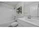 Bathroom with white tile and tub at 834 Mamie Upchurch Rd, Lillington, NC 27546