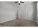 Bedroom featuring neutral carpet, closet and adjacent entrance to another room at 834 Mamie Upchurch Rd, Lillington, NC 27546