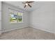 Cozy bedroom with plush carpet and a bright window offering a pleasant view at 834 Mamie Upchurch Rd, Lillington, NC 27546