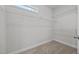 Walk-in closet featuring carpeted floors and wire shelving at 834 Mamie Upchurch Rd, Lillington, NC 27546