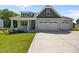 Charming home features a welcoming front porch and a convenient three-car garage at 834 Mamie Upchurch Rd, Lillington, NC 27546