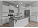 Bright kitchen featuring granite countertops, a large island and stainless appliances at 834 Mamie Upchurch Rd, Lillington, NC 27546