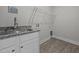 Practical laundry room with granite countertop and utility sink at 834 Mamie Upchurch Rd, Lillington, NC 27546