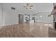Open-concept living area featuring a kitchen with island and stone fireplace at 834 Mamie Upchurch Rd, Lillington, NC 27546