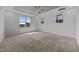 Spacious main bedroom with plush carpet and views from the large windows at 834 Mamie Upchurch Rd, Lillington, NC 27546