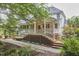 Exterior view of home featuring a wooden deck and stone pathway at 8605 Stanton Pl, Raleigh, NC 27615