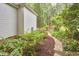 Landscaped backyard with a stone path, providing a serene escape and enhancing the property's appeal at 8605 Stanton Pl, Raleigh, NC 27615