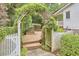 Charming fenced deck with a vine-covered trellis, creating a private and inviting outdoor space at 8605 Stanton Pl, Raleigh, NC 27615
